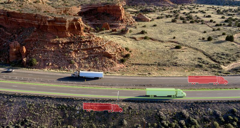 Trucks on a highway with graphics